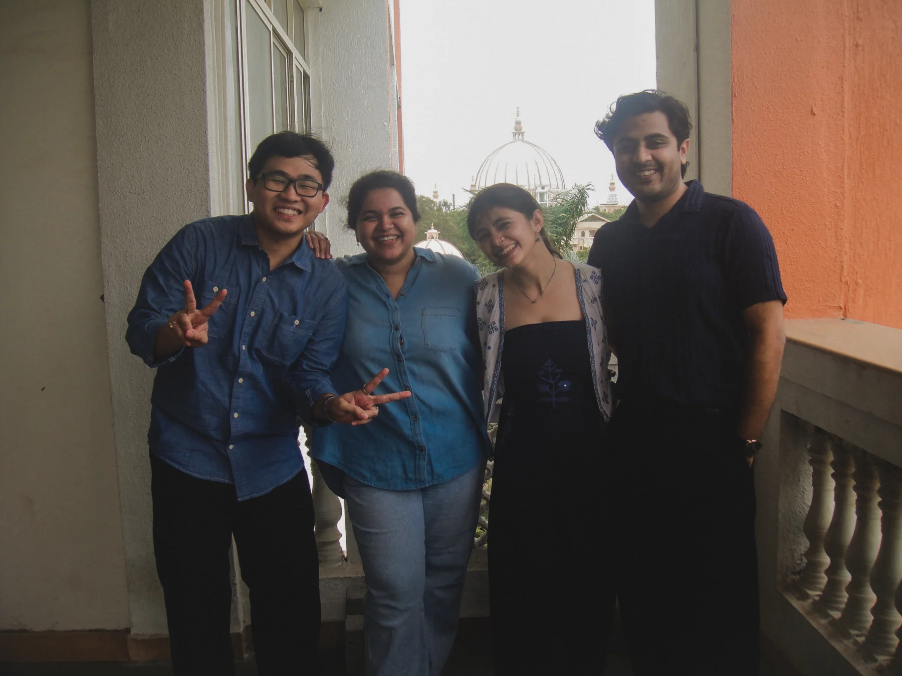 The four-person Soulka team together on a balcony